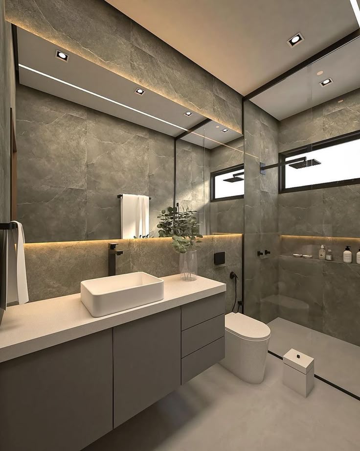 Baño con acabados de mármol